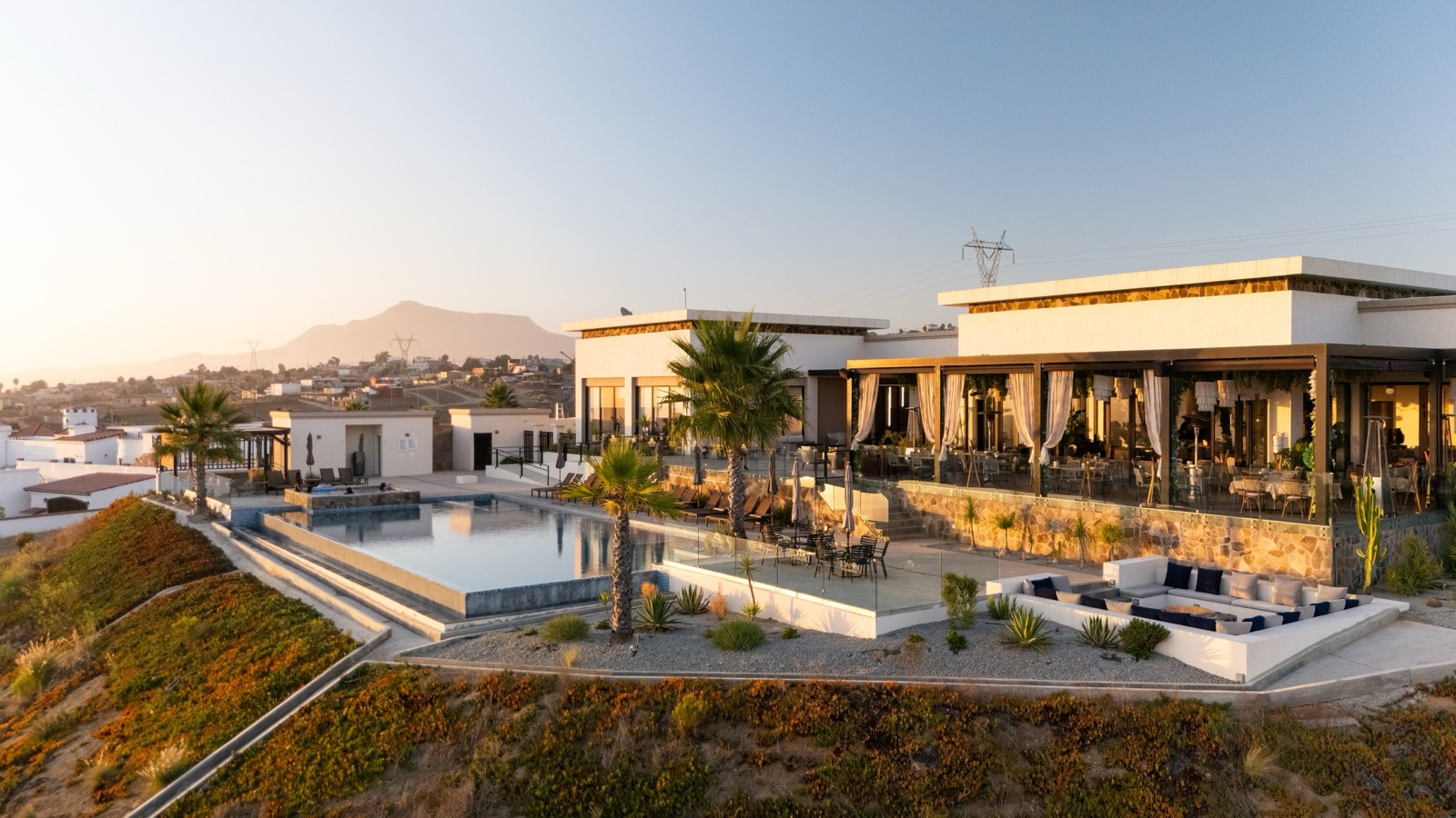 Golden-hour aerial of the residents' club at Rancho El Descanso